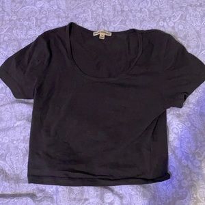 a gray cropped short sleeve shirt.